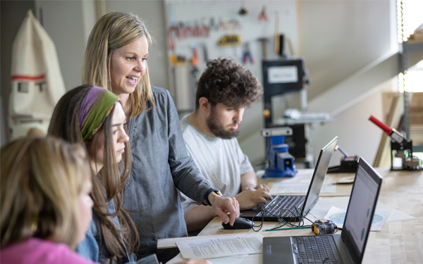 Professor assisting students