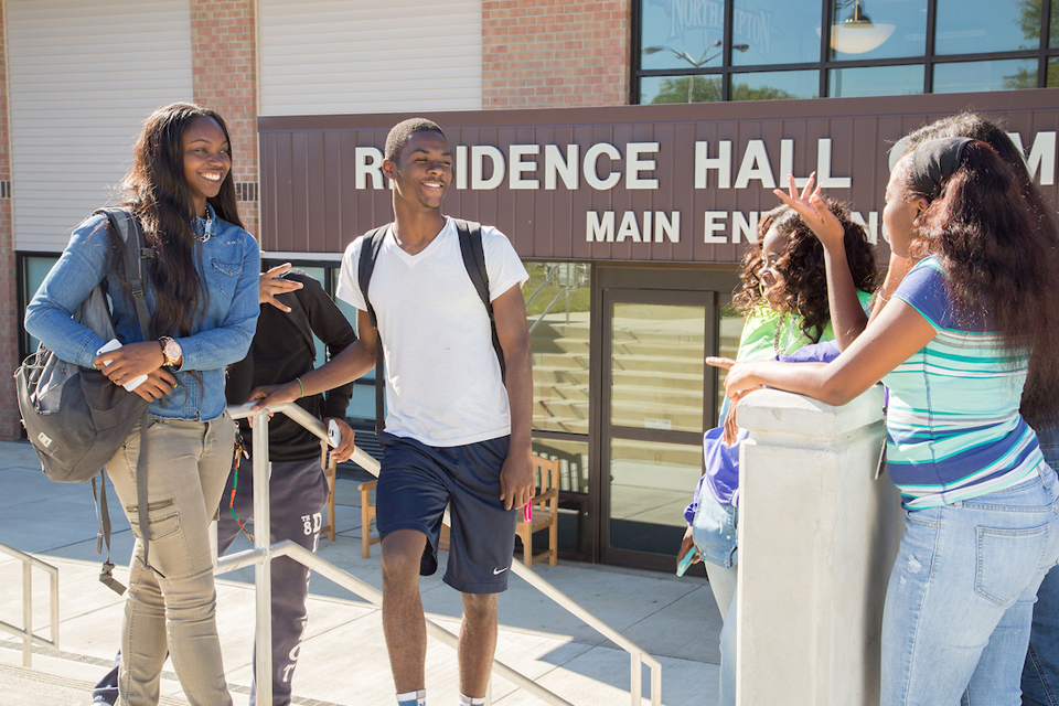 students in front of NCC residence hall