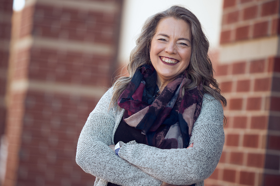 photo of smiling adult student outside on campus