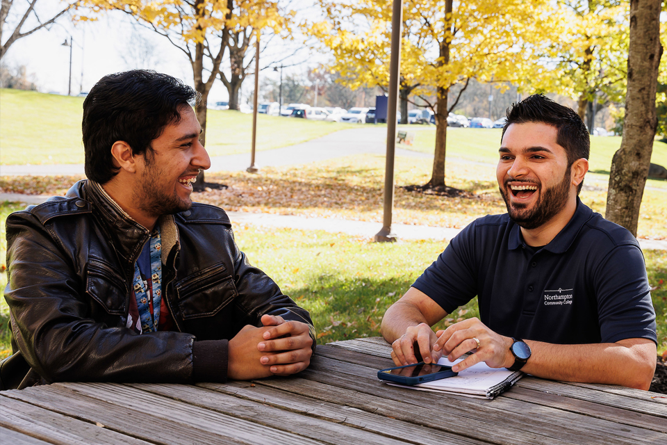 Students talking at a table