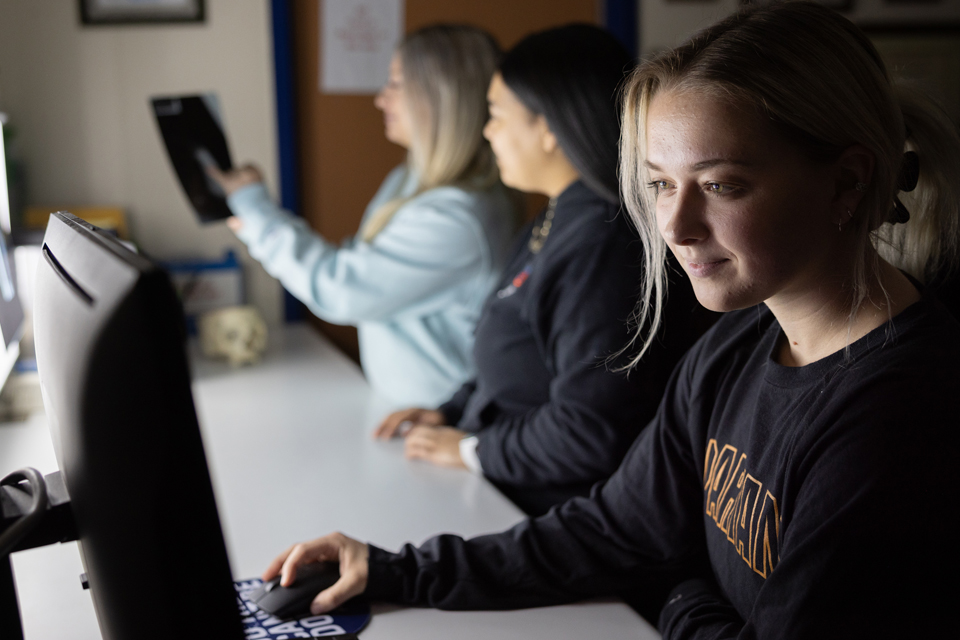 student studying at computer