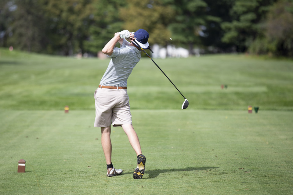 Employee golfing