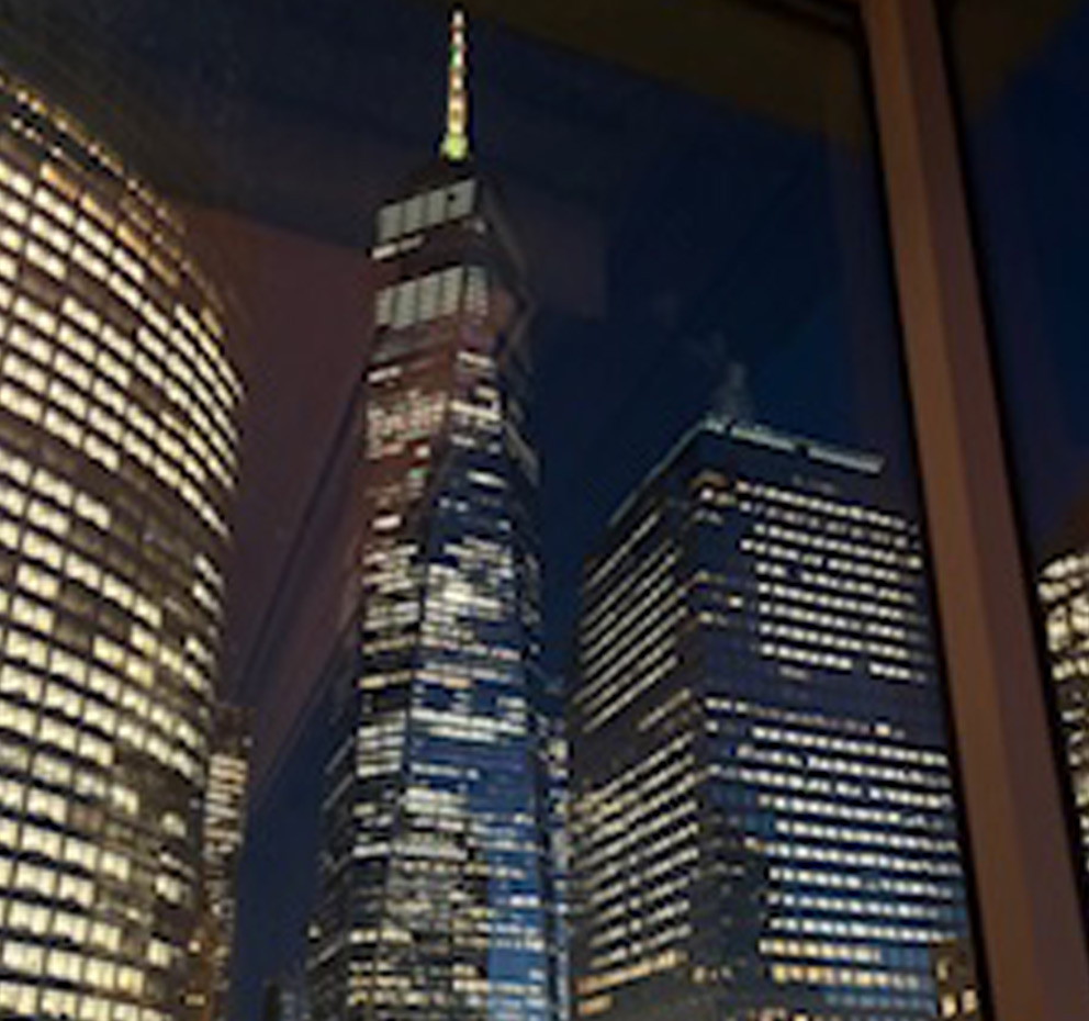 View of the Freedom Tower at night from a hotel room window