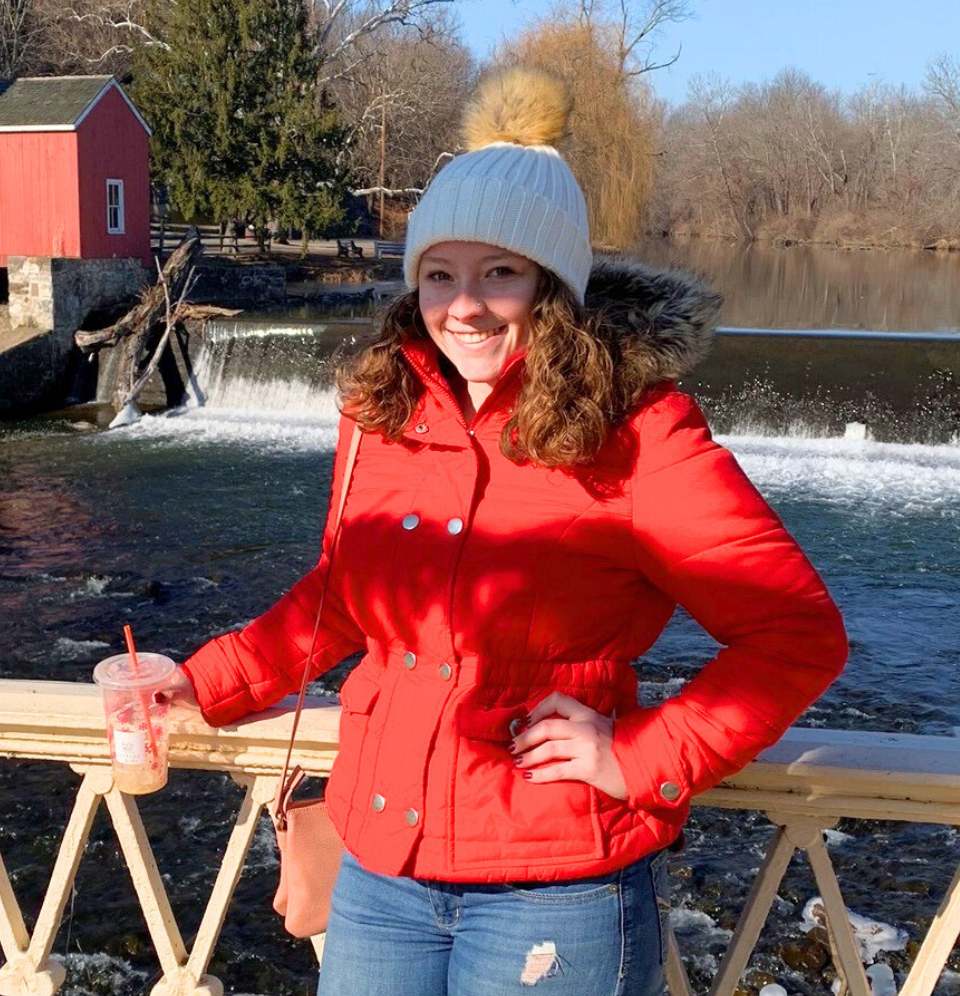 Kelsey Miller standing on bridge smiling