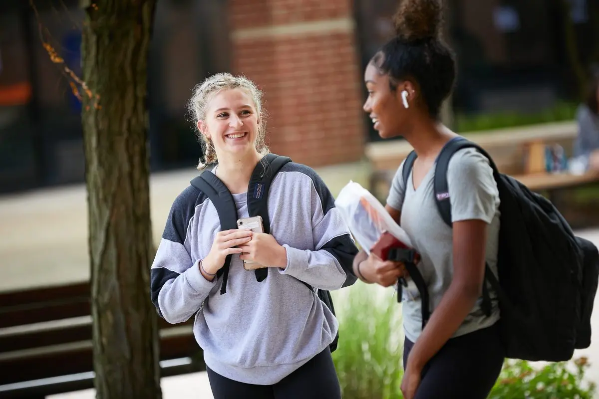 2 NCC students walking outside