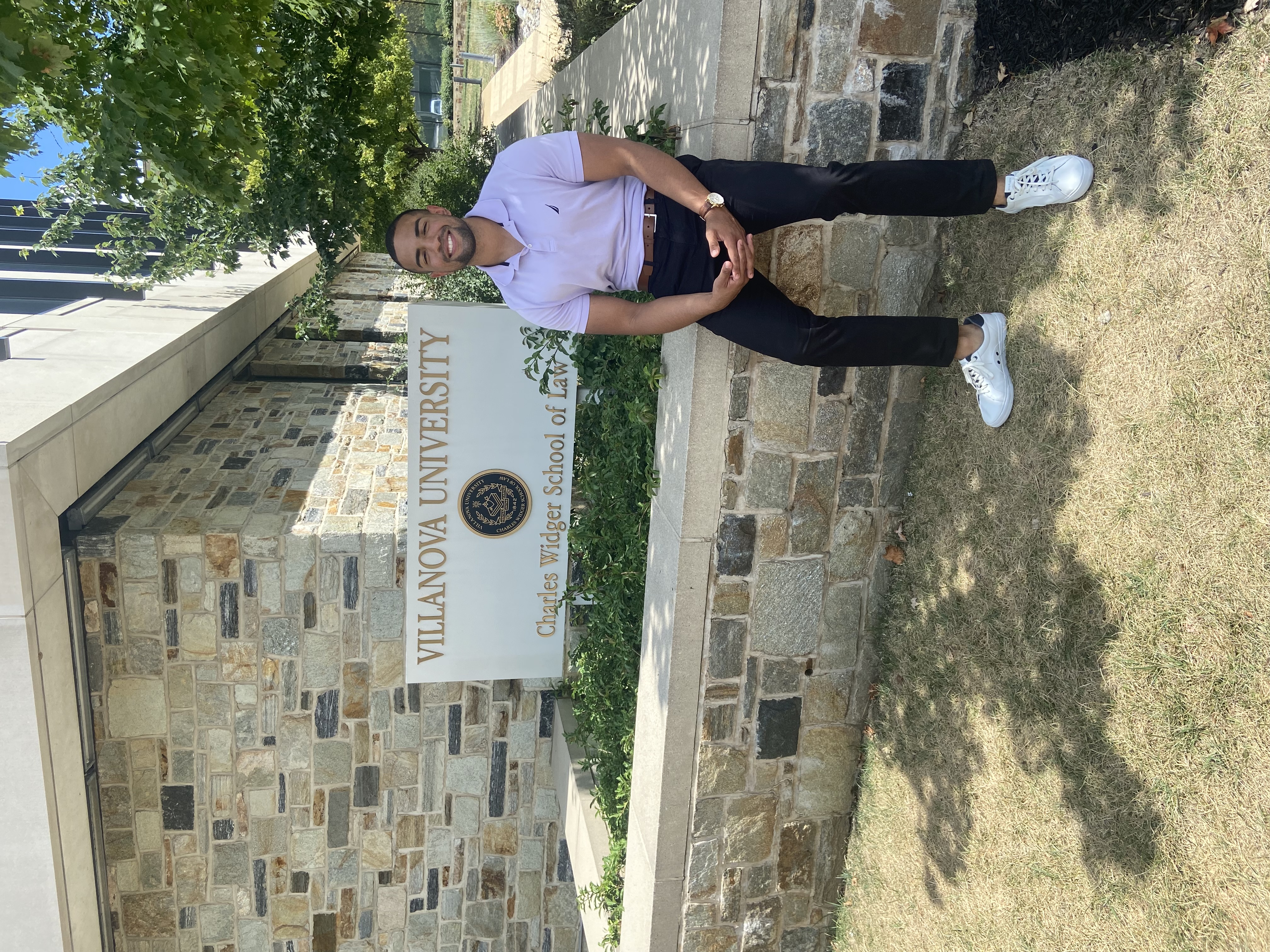 Lauriston sitting outside of Villanova Law School