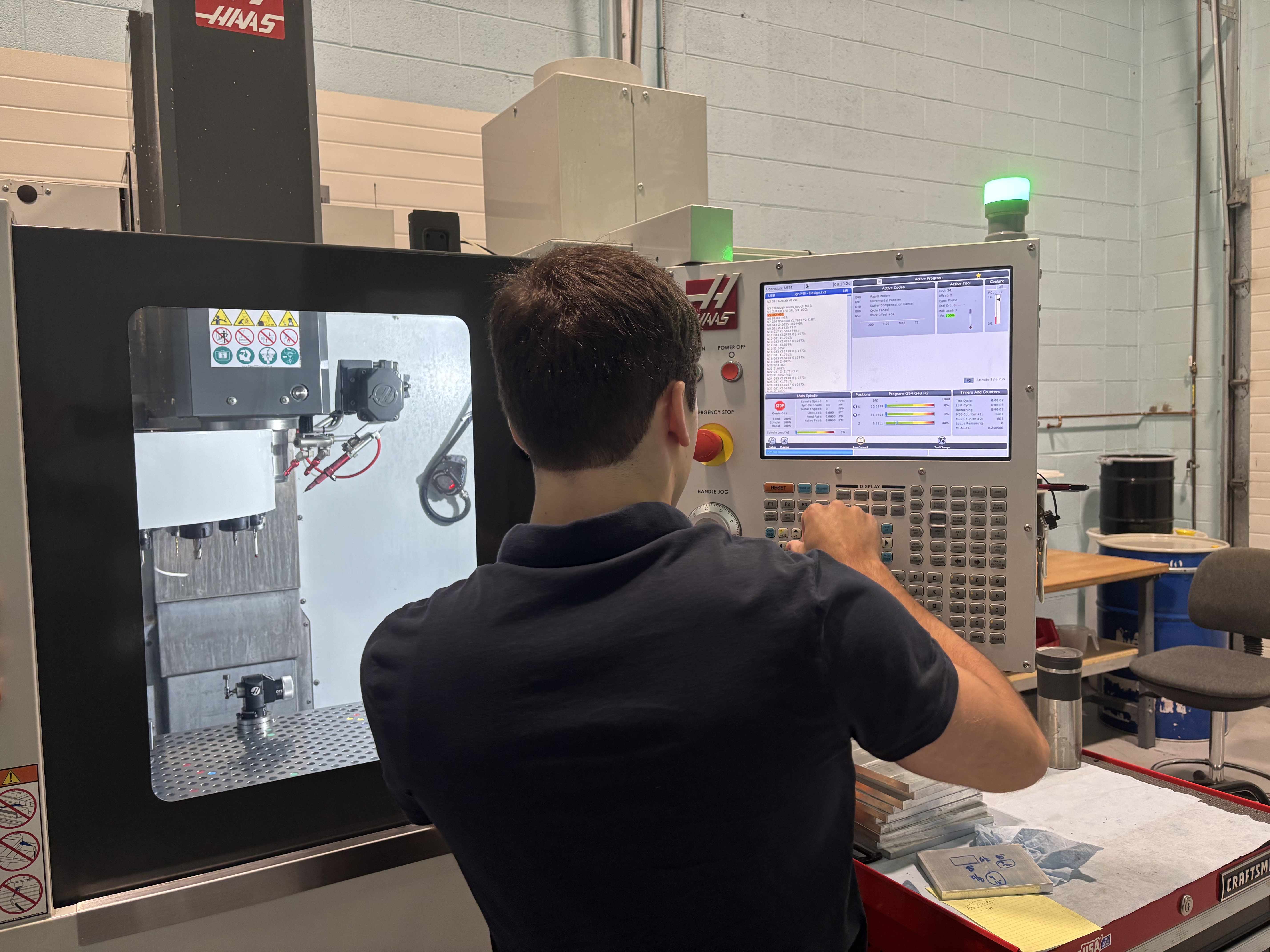 Tocci Operating CNC Machine