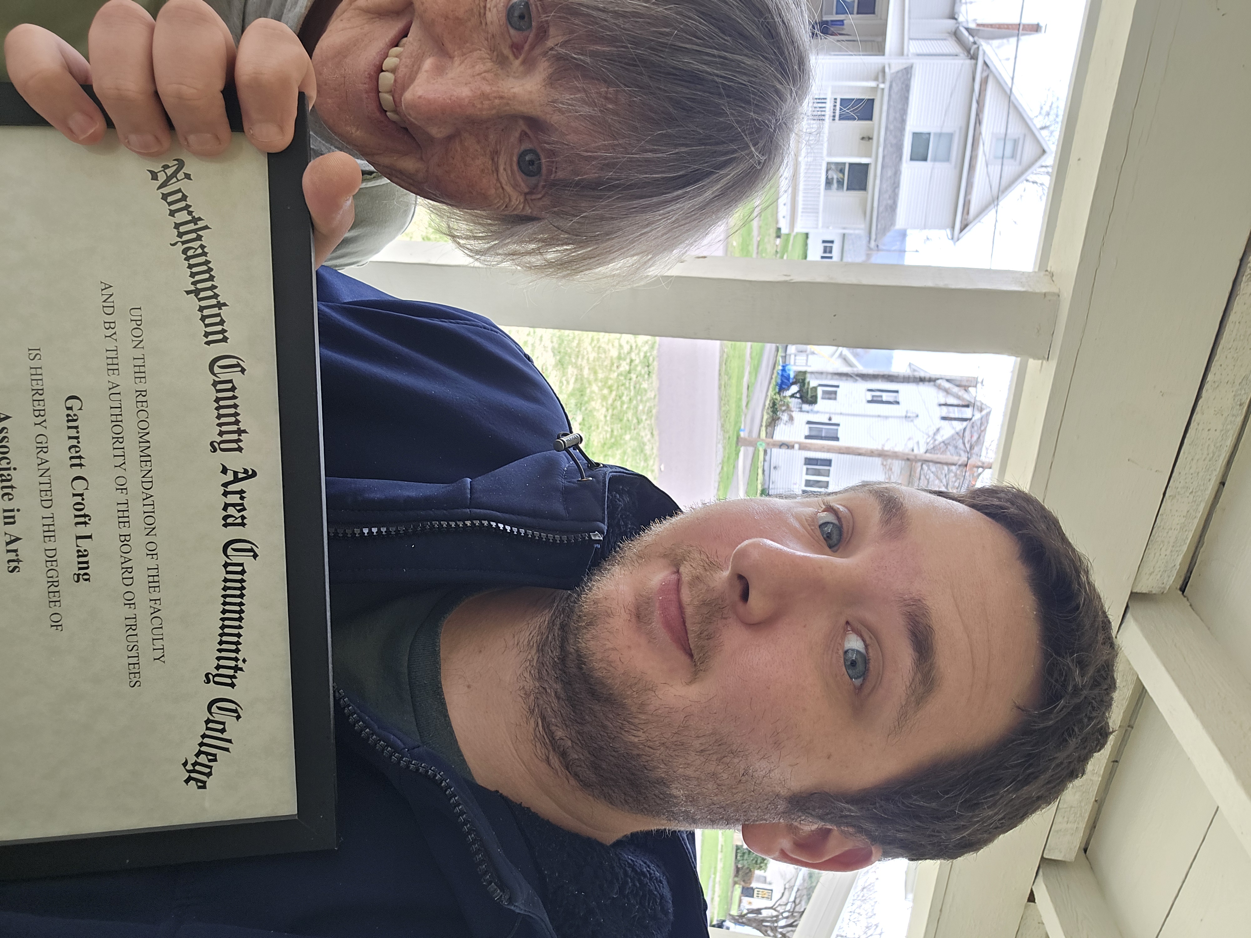 Lang and his mother with NCC degree